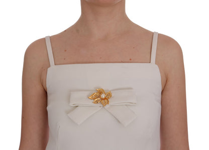 Elegante witte wollen shiftjurk met gouden broche